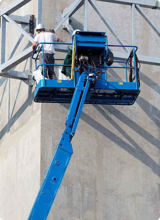 Access Equipment - Blue Scissor Lift Up on Exterior of Building with Two Men